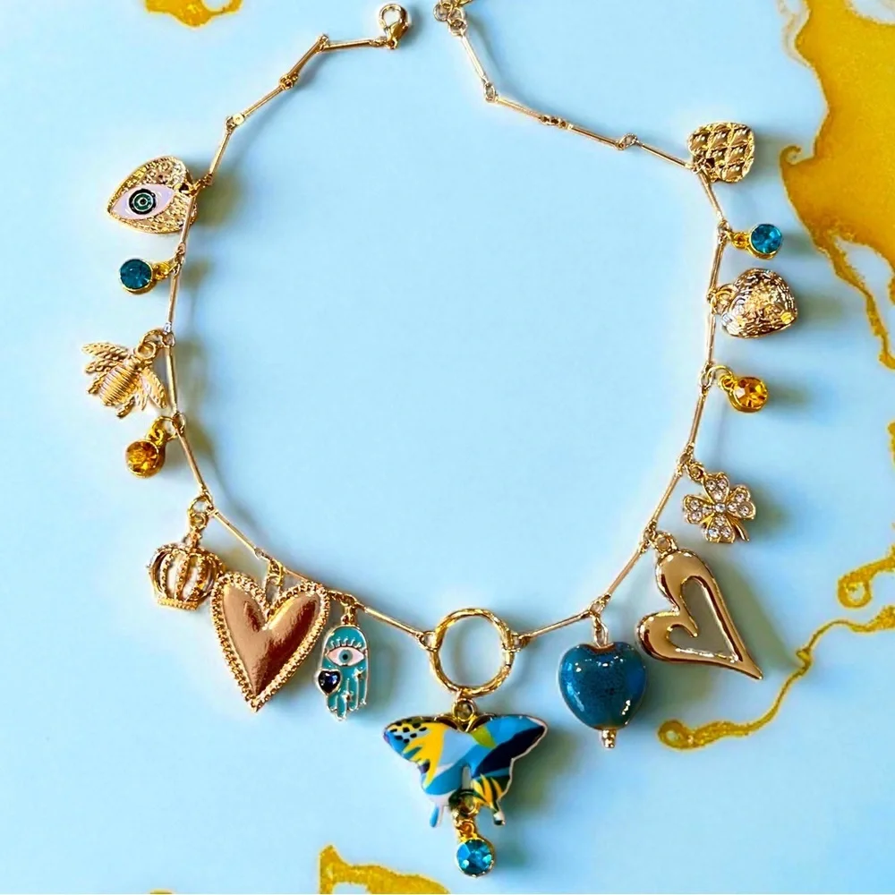 Unique and Gorgeous Gold toned Necklace with Varying Blue and Yellow Charms